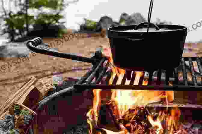 A Chef Cooking Over A Campfire In A Snowy Forest In The Wild Chef: Recipes From Base Camp To Summit