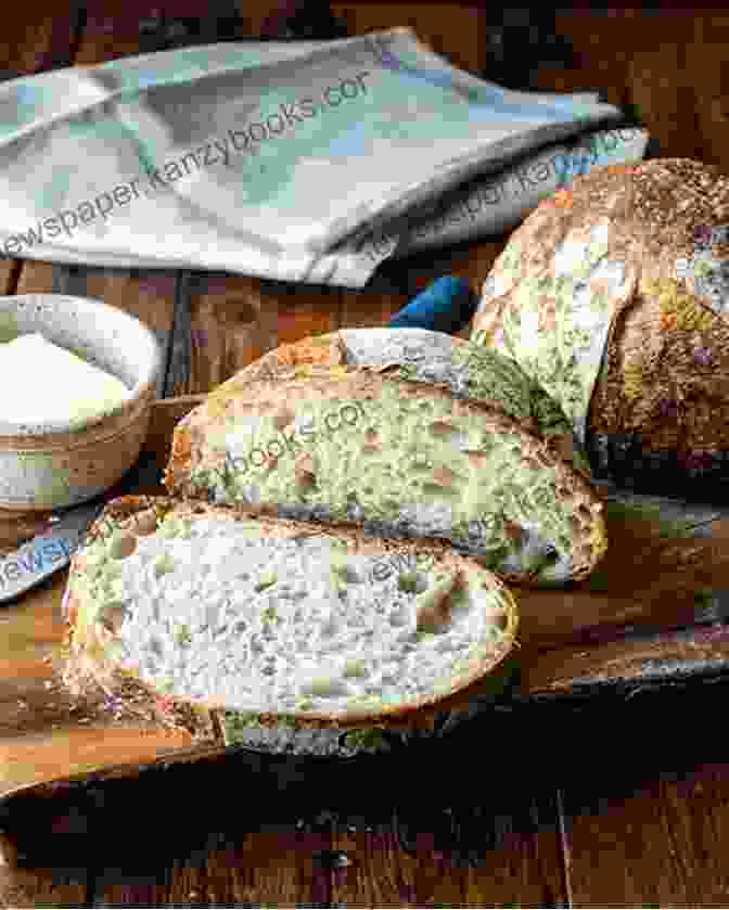 A Loaf Of Sourdough Bread On A Cutting Board Breadmaking: Essential Guide For Beginners (Self Sufficiency)